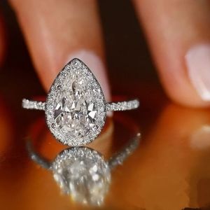 Silver halo pear shaped ring